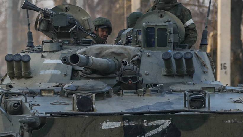Russian servicemen drive on the infantry armoured vehicle in downtown of Volnovakha, Ukraine, 26 March 2022. Troops of the self-proclaimed Donetsk People's Republic with Russian support entered Volnovakha, a small town near Donetsk. Donetsk People's Republic official said that the housing stock of the city of Volnovakha was destroyed by 85 percent, the city would have to be rebuilt. On 24 February Russian troops had entered Ukrainian territory in what the Russian president declared a 'special military operation', resulting in fighting and destruction in the country, a huge flow of refugees, and multiple sanctions against Russia. Fot. PAP/EPA/SERGEI ILNITSKY