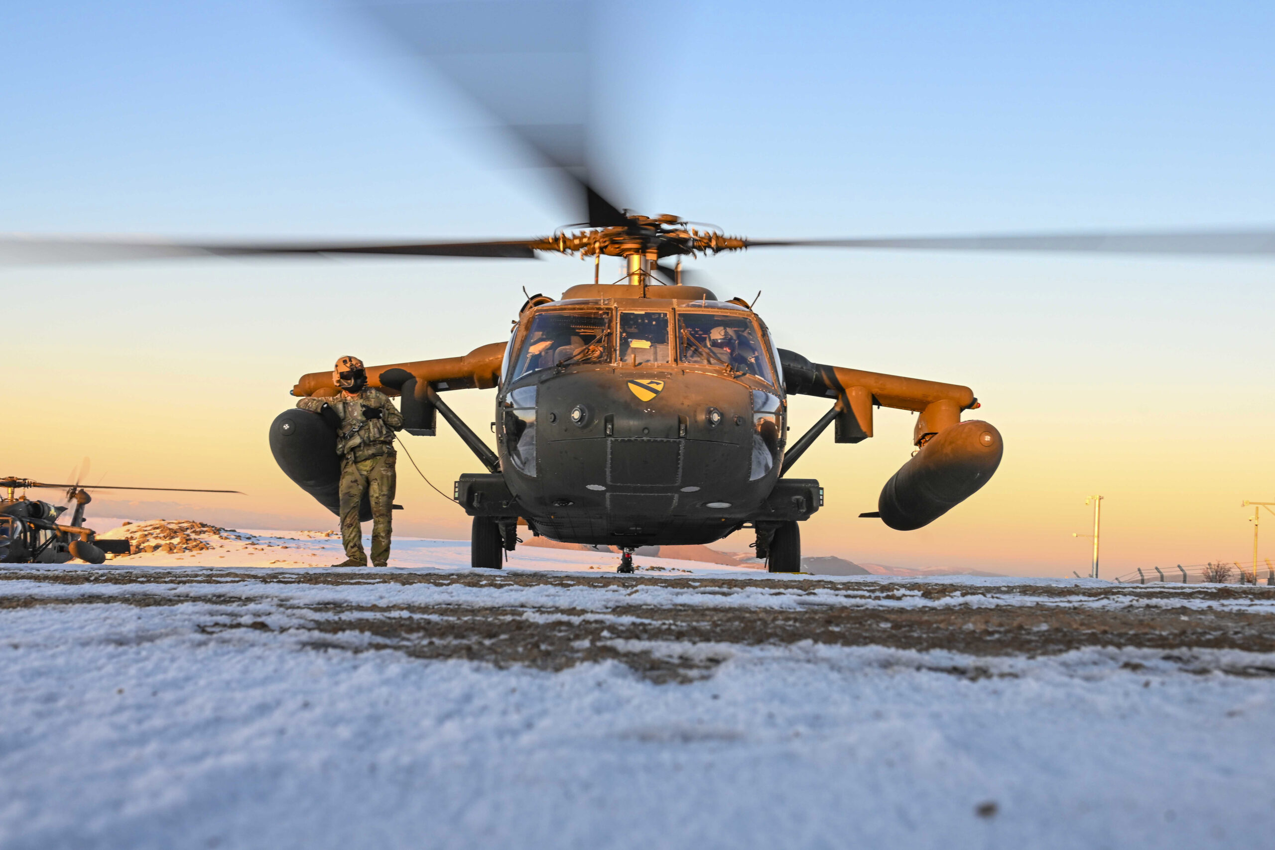 U.S. Army Spc. Jaylin Linden, left, a UH-60 Black Hawk crew chief, and Capt. Christian Stavig, a UH-60 Black Hawk pilot, assigned to 3rd Battalion, 227th Assault Helicopter Battalion, 1st Air Cavalry Brigade, readies a UH-60 Black Hawk in Türkiye airspace, Jan. 28, 2025. Members assigned to 3rd Battalion, 227th Assault Helicopter Battalion, 1st Air Cavalry Brigade, conduct training flights, honing advanced aviation skills and tactical operations in a strategically vital region. (U.S. Air Force photo by Senior Airman Haiden Morris)