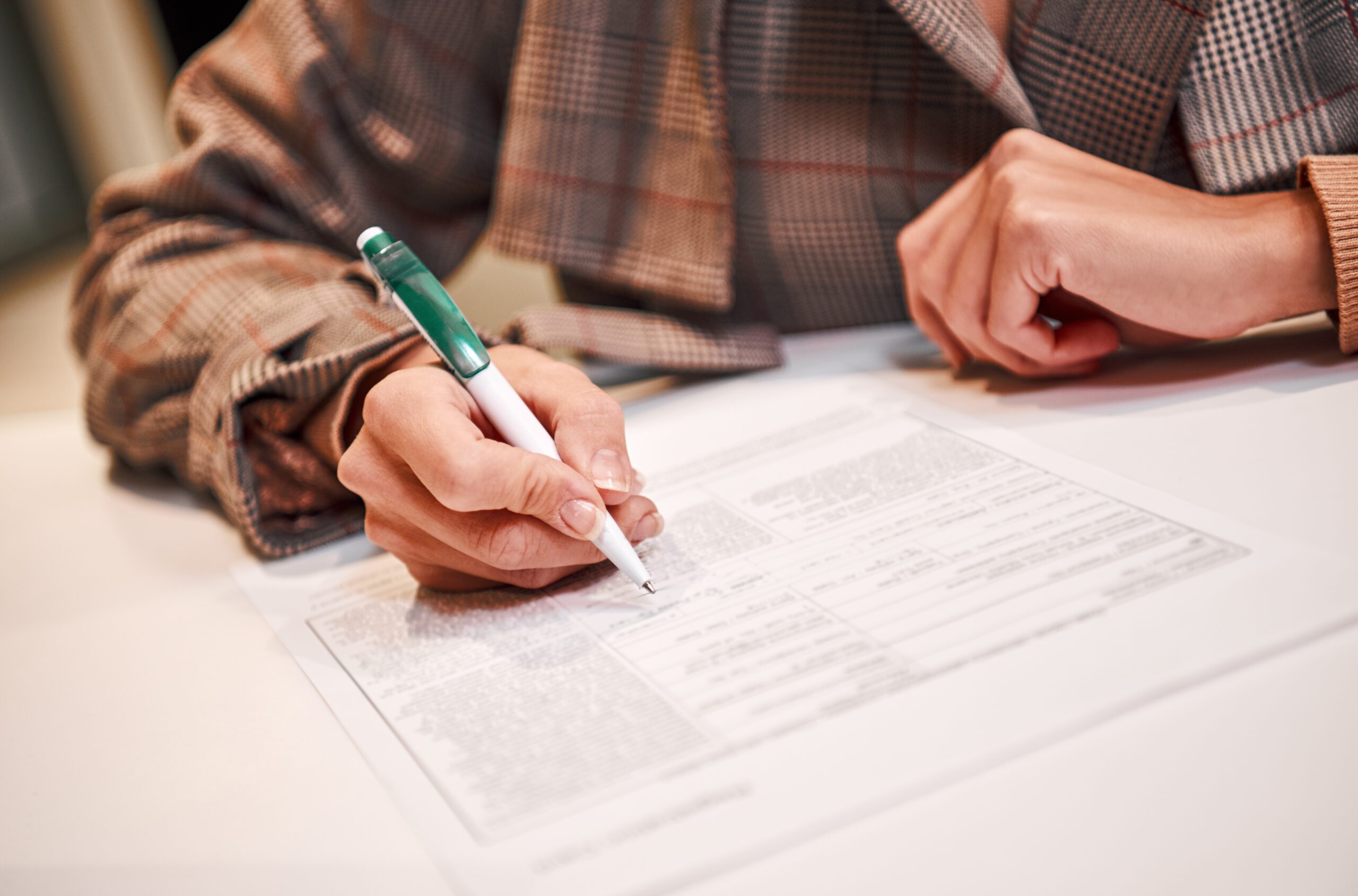 Time to sign deal contract. Businesswoman is fulfilling and signing contract