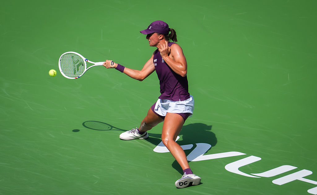 WUHAN, CHINA - OCTOBER 14: Iga Swiatek of Poland in action against Magda Linette of Poland in the women's singles second round on Day 3 of the Dongfeng Voyah Wuhan Open at Optics Valley International Tennis Center on October 14, 2026 in Wuhan, China. (Photo by Robert Prange/Getty Images)